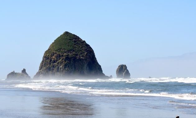 iconic Haystack Rock at Cannon Beach - Affordable beach vacations USA